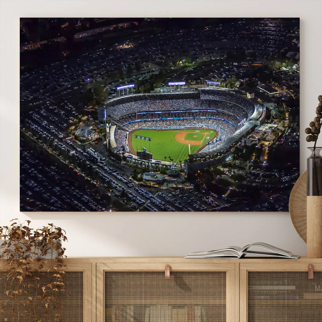 A stunning triptych of Dodger Stadium, captured in a brightly lit aerial view at night, adorns the wall. This Los Angeles Dodgers wall art is crafted with a gallery-quality finish on premium canvas.