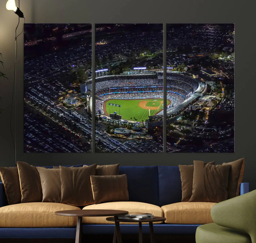 A stunning triptych of Dodger Stadium, captured in a brightly lit aerial view at night, adorns the wall. This Los Angeles Dodgers wall art is crafted with a gallery-quality finish on premium canvas.