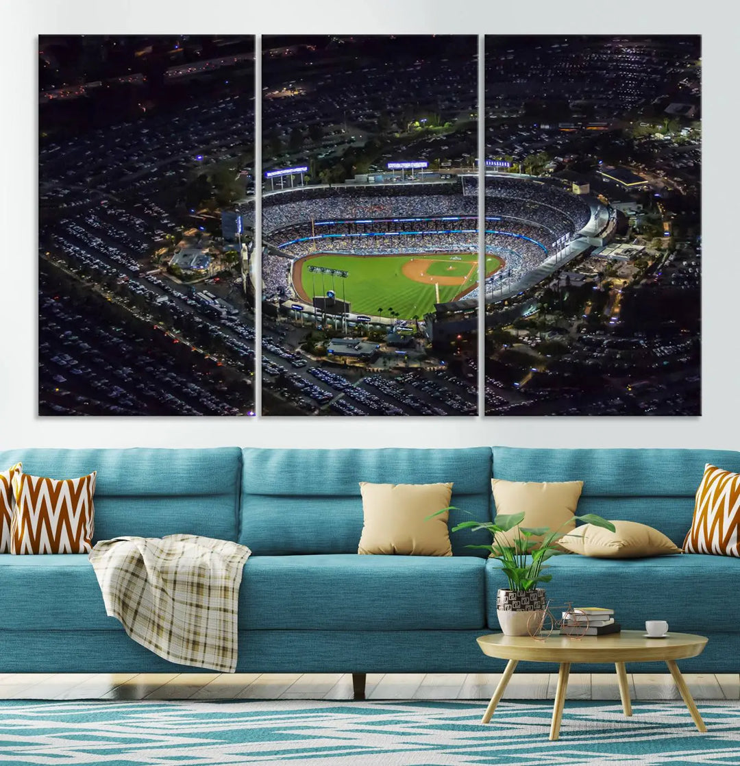 A stunning triptych of Dodger Stadium, captured in a brightly lit aerial view at night, adorns the wall. This Los Angeles Dodgers wall art is crafted with a gallery-quality finish on premium canvas.