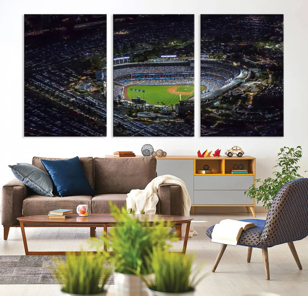 A stunning triptych of Dodger Stadium, captured in a brightly lit aerial view at night, adorns the wall. This Los Angeles Dodgers wall art is crafted with a gallery-quality finish on premium canvas.