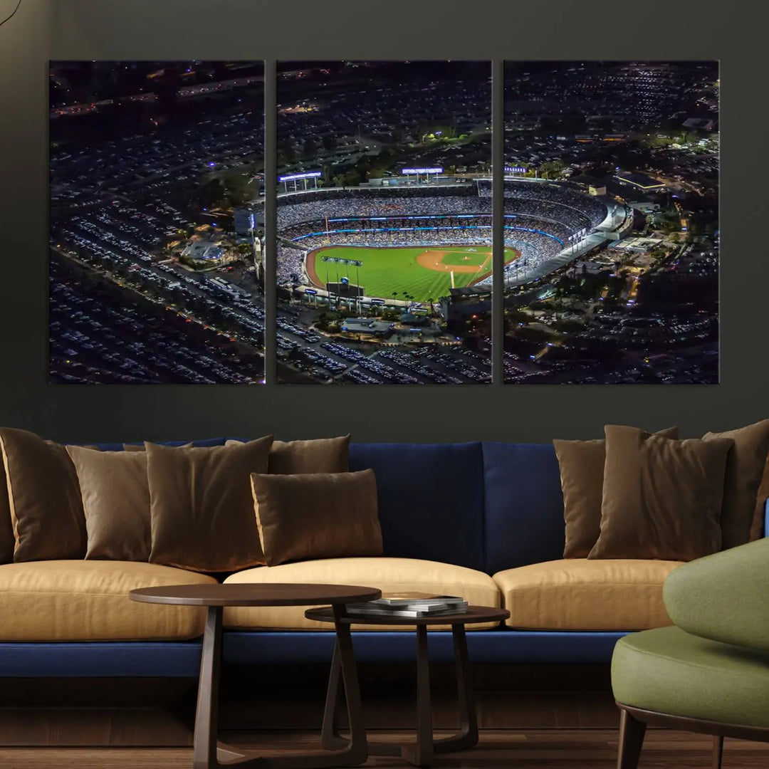 A stunning triptych of Dodger Stadium, captured in a brightly lit aerial view at night, adorns the wall. This Los Angeles Dodgers wall art is crafted with a gallery-quality finish on premium canvas.