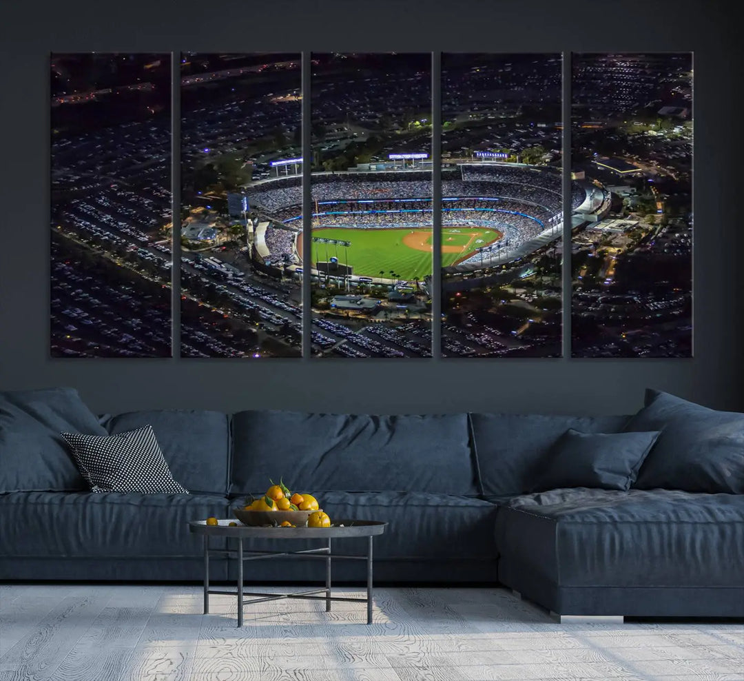 A stunning triptych of Dodger Stadium, captured in a brightly lit aerial view at night, adorns the wall. This Los Angeles Dodgers wall art is crafted with a gallery-quality finish on premium canvas.