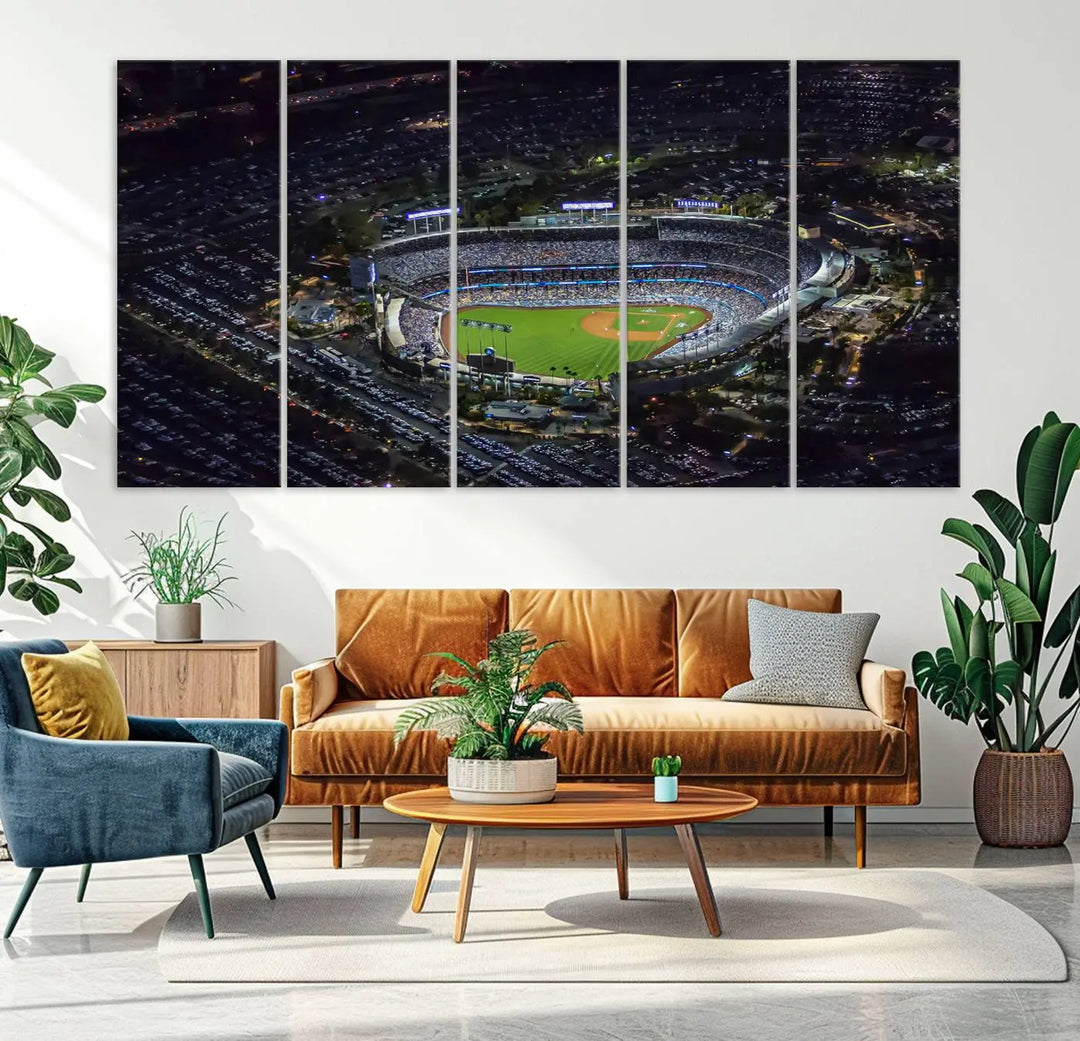 A stunning triptych of Dodger Stadium, captured in a brightly lit aerial view at night, adorns the wall. This Los Angeles Dodgers wall art is crafted with a gallery-quality finish on premium canvas.