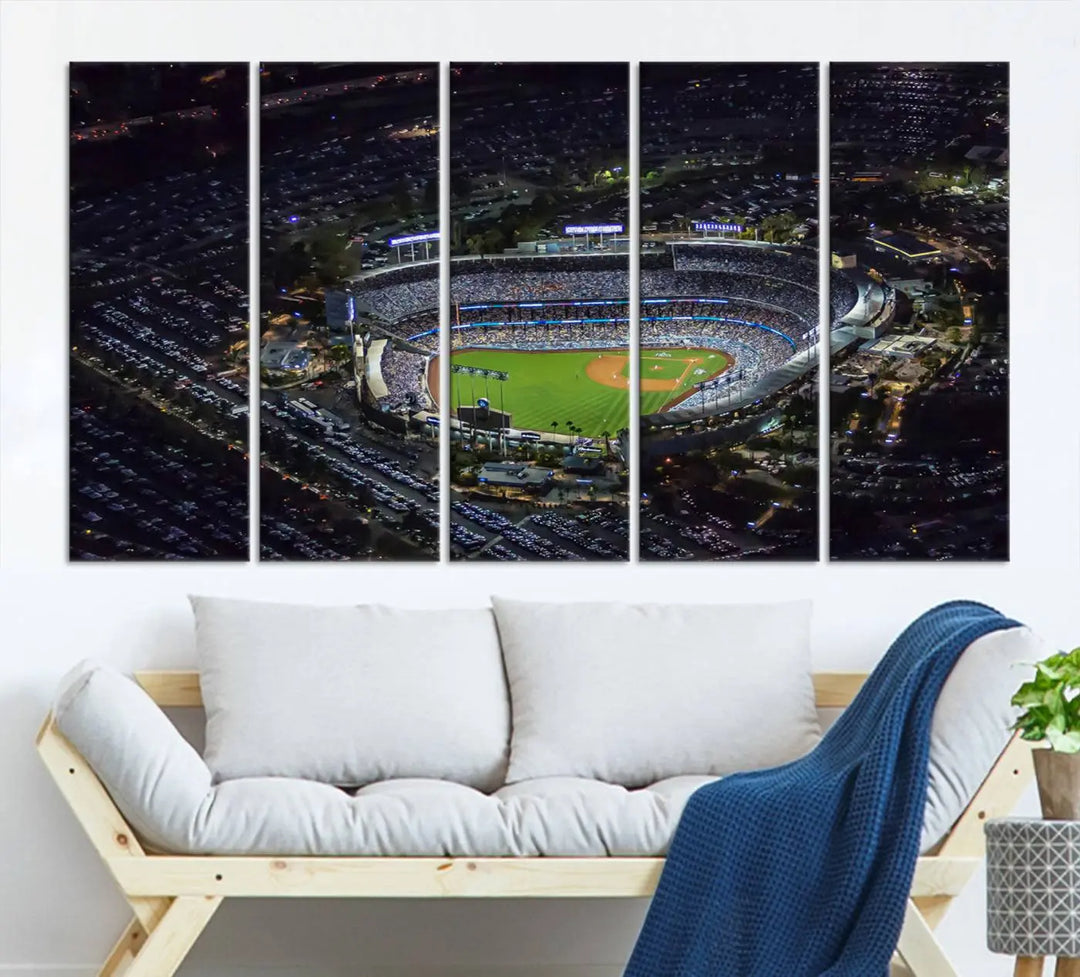 A stunning triptych of Dodger Stadium, captured in a brightly lit aerial view at night, adorns the wall. This Los Angeles Dodgers wall art is crafted with a gallery-quality finish on premium canvas.