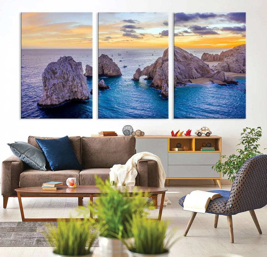 The living room features the Los Cabos San Lucas Ocean Canvas Wall Art Print, showcasing Mexico's Cabo Arch. Made from museum-quality canvases with UV-protective coating, this triptych wall art depicts a coastal scene at sunset and arrives ready to hang for effortless elegance.