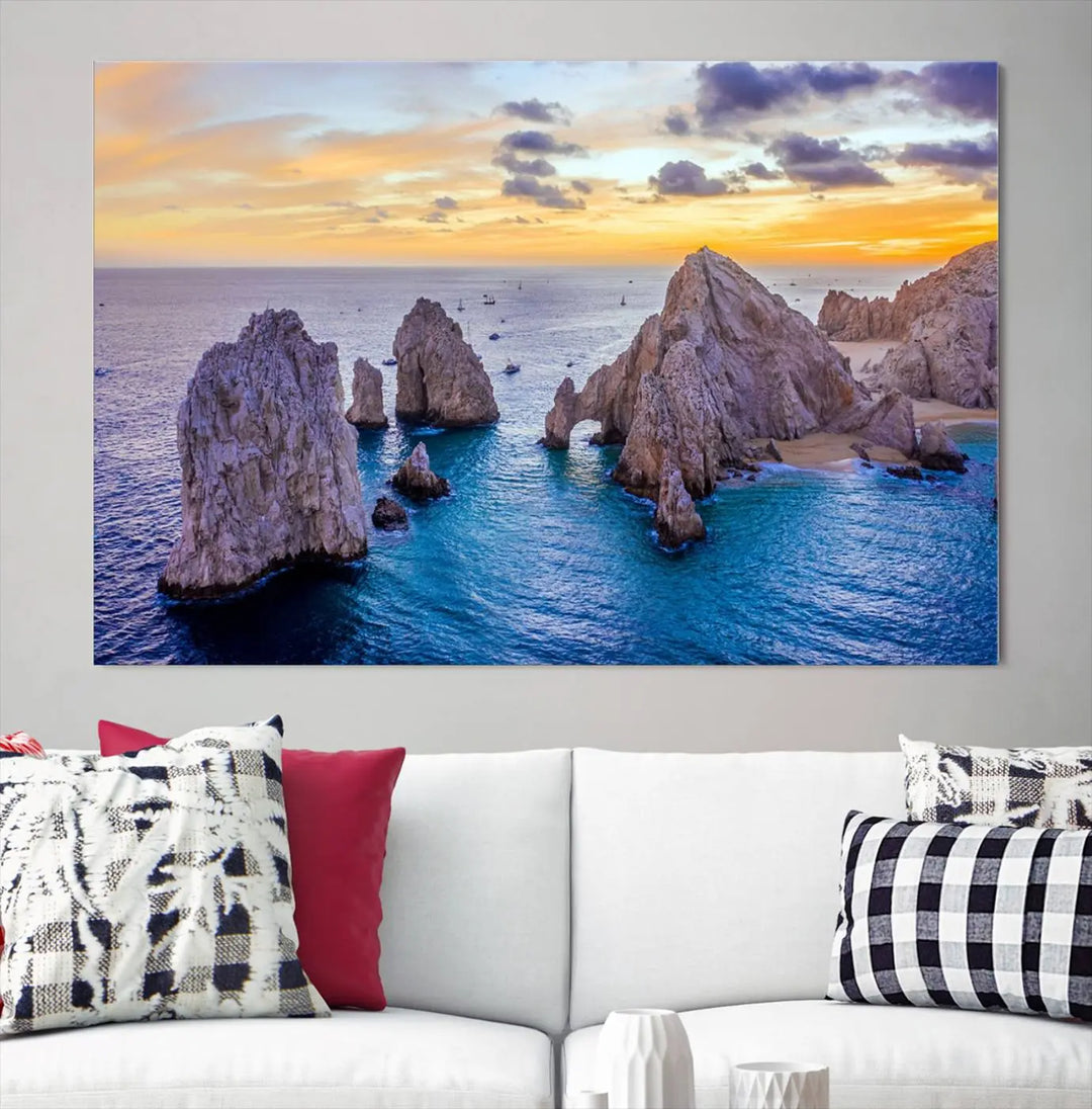 The living room features the Los Cabos San Lucas Ocean Canvas Wall Art Print, showcasing Mexico's Cabo Arch. Made from museum-quality canvases with UV-protective coating, this triptych wall art depicts a coastal scene at sunset and arrives ready to hang for effortless elegance.