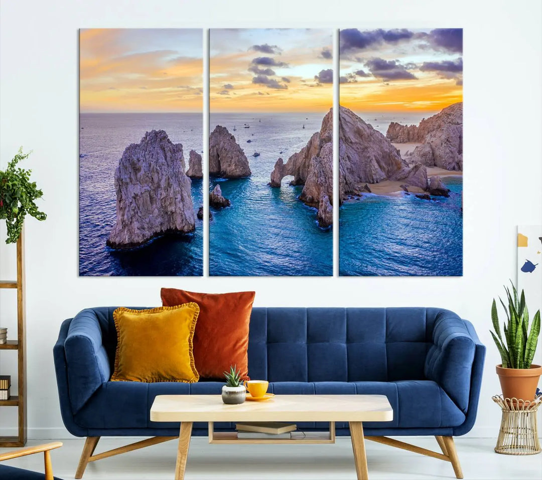 The living room features the Los Cabos San Lucas Ocean Canvas Wall Art Print, showcasing Mexico's Cabo Arch. Made from museum-quality canvases with UV-protective coating, this triptych wall art depicts a coastal scene at sunset and arrives ready to hang for effortless elegance.