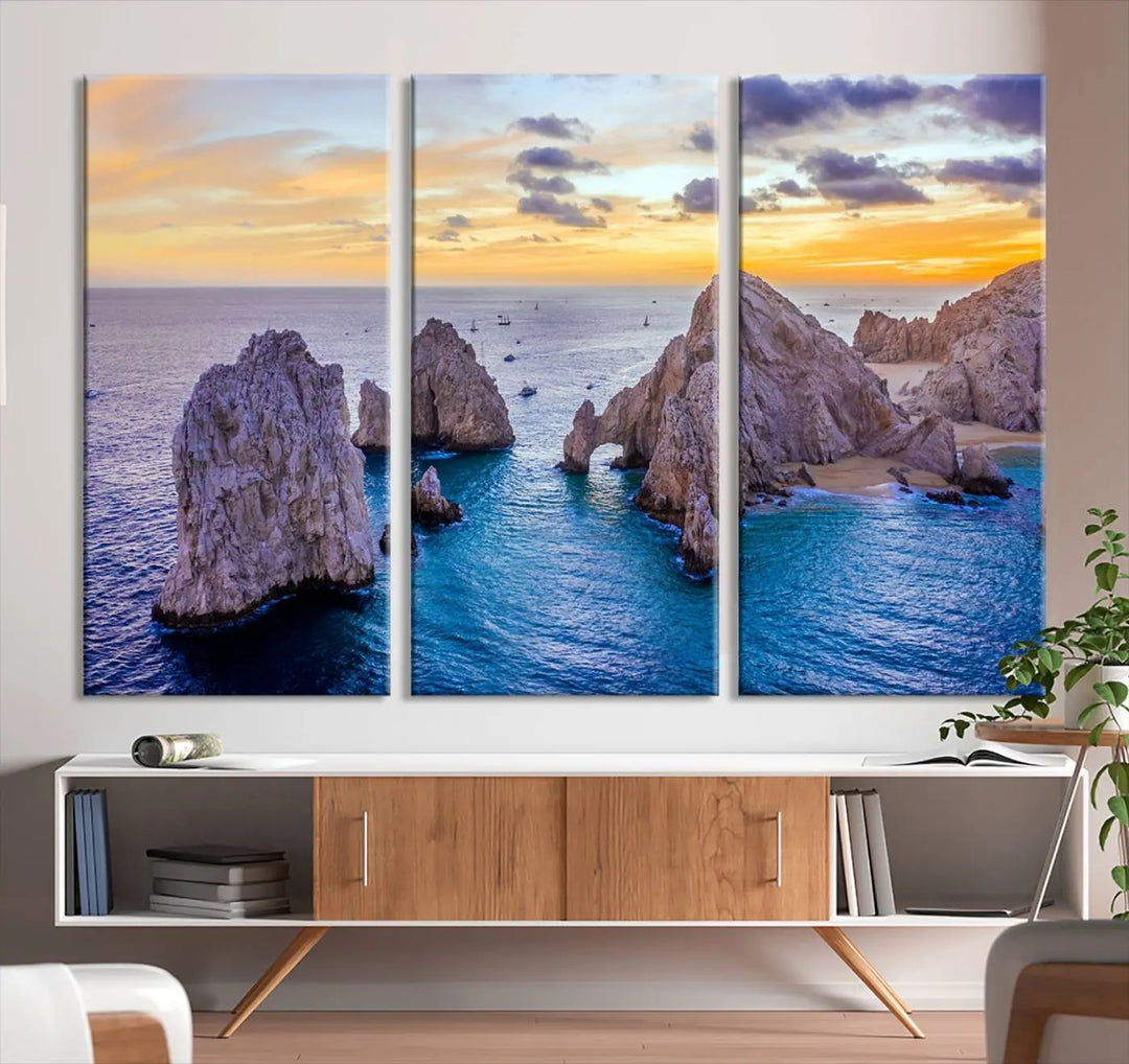 The living room features the Los Cabos San Lucas Ocean Canvas Wall Art Print, showcasing Mexico's Cabo Arch. Made from museum-quality canvases with UV-protective coating, this triptych wall art depicts a coastal scene at sunset and arrives ready to hang for effortless elegance.