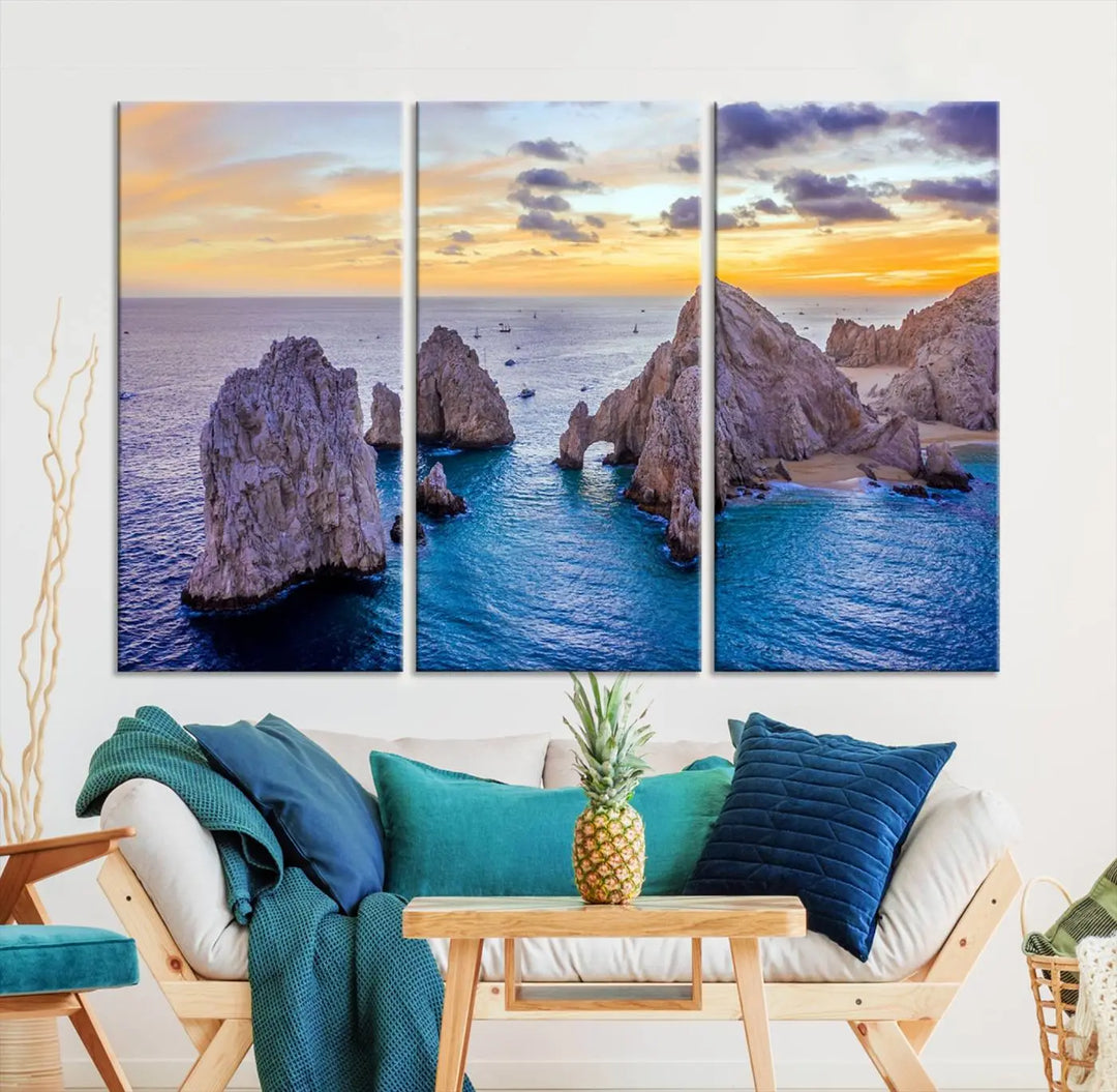 The living room features the Los Cabos San Lucas Ocean Canvas Wall Art Print, showcasing Mexico's Cabo Arch. Made from museum-quality canvases with UV-protective coating, this triptych wall art depicts a coastal scene at sunset and arrives ready to hang for effortless elegance.