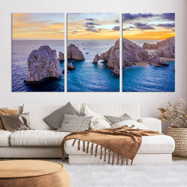 The living room features the Los Cabos San Lucas Ocean Canvas Wall Art Print, showcasing Mexico's Cabo Arch. Made from museum-quality canvases with UV-protective coating, this triptych wall art depicts a coastal scene at sunset and arrives ready to hang for effortless elegance.