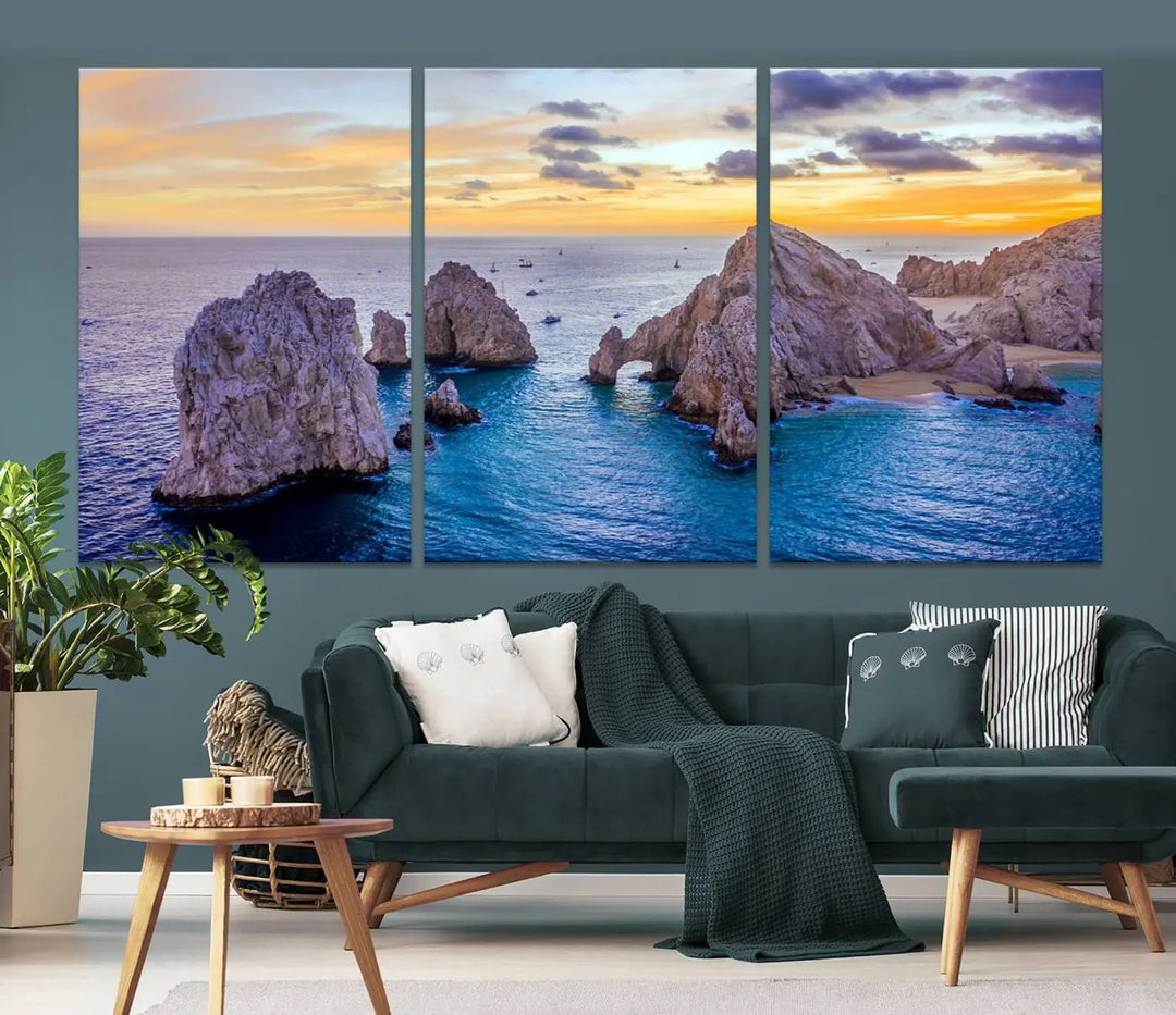 The living room features the Los Cabos San Lucas Ocean Canvas Wall Art Print, showcasing Mexico's Cabo Arch. Made from museum-quality canvases with UV-protective coating, this triptych wall art depicts a coastal scene at sunset and arrives ready to hang for effortless elegance.