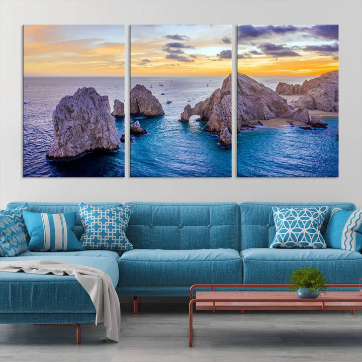 The living room features the Los Cabos San Lucas Ocean Canvas Wall Art Print, showcasing Mexico's Cabo Arch. Made from museum-quality canvases with UV-protective coating, this triptych wall art depicts a coastal scene at sunset and arrives ready to hang for effortless elegance.