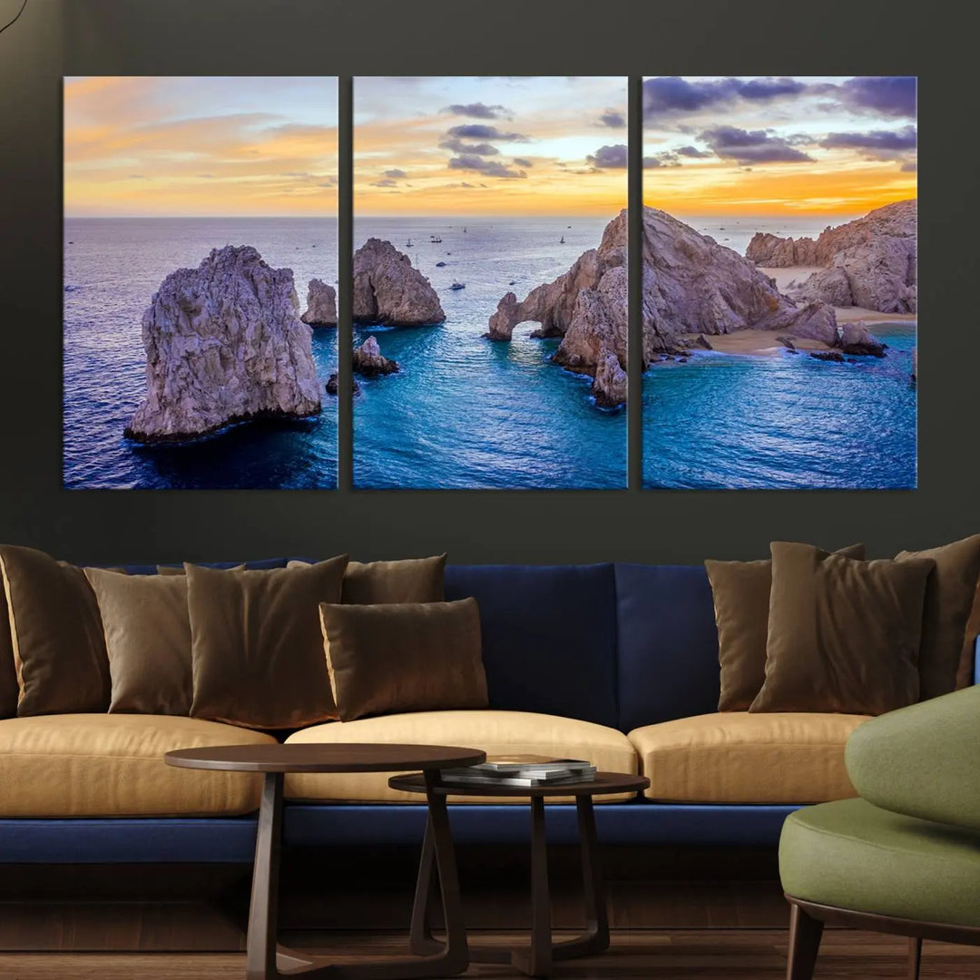 The living room features the Los Cabos San Lucas Ocean Canvas Wall Art Print, showcasing Mexico's Cabo Arch. Made from museum-quality canvases with UV-protective coating, this triptych wall art depicts a coastal scene at sunset and arrives ready to hang for effortless elegance.