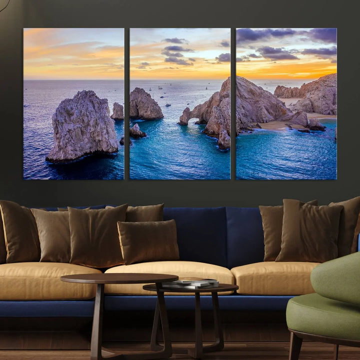 The living room features the Los Cabos San Lucas Ocean Canvas Wall Art Print, showcasing Mexico's Cabo Arch. Made from museum-quality canvases with UV-protective coating, this triptych wall art depicts a coastal scene at sunset and arrives ready to hang for effortless elegance.