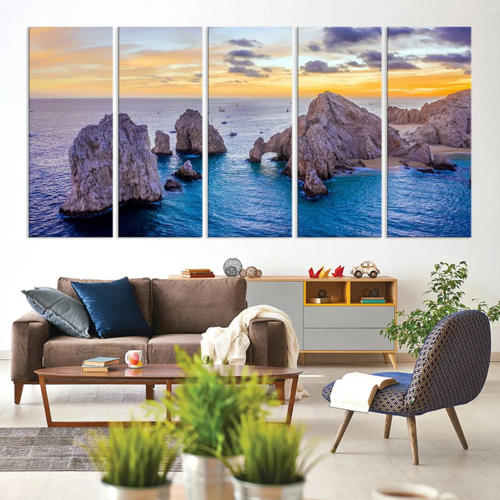 The living room features the Los Cabos San Lucas Ocean Canvas Wall Art Print, showcasing Mexico's Cabo Arch. Made from museum-quality canvases with UV-protective coating, this triptych wall art depicts a coastal scene at sunset and arrives ready to hang for effortless elegance.