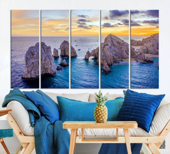 The living room features the Los Cabos San Lucas Ocean Canvas Wall Art Print, showcasing Mexico's Cabo Arch. Made from museum-quality canvases with UV-protective coating, this triptych wall art depicts a coastal scene at sunset and arrives ready to hang for effortless elegance.