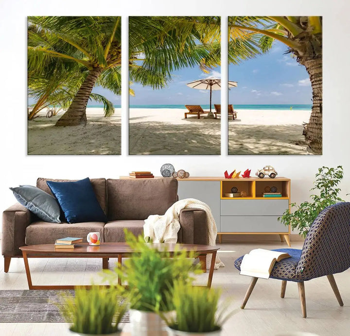 The living room features the "Lounge Chairs Palm Trees on Tropical Beach" canvas wall art print, offering museum-quality craftsmanship.