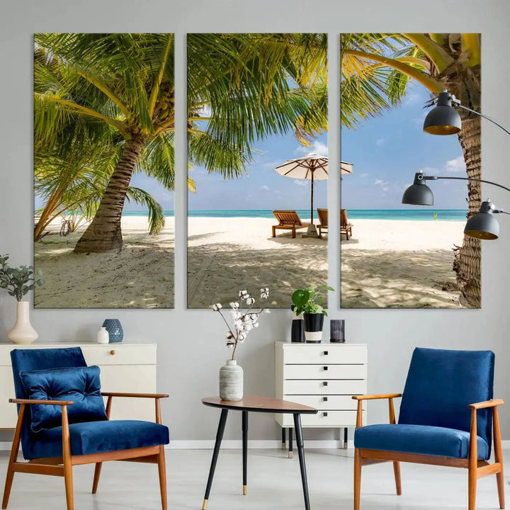 The living room features the "Lounge Chairs Palm Trees on Tropical Beach" canvas wall art print, offering museum-quality craftsmanship.