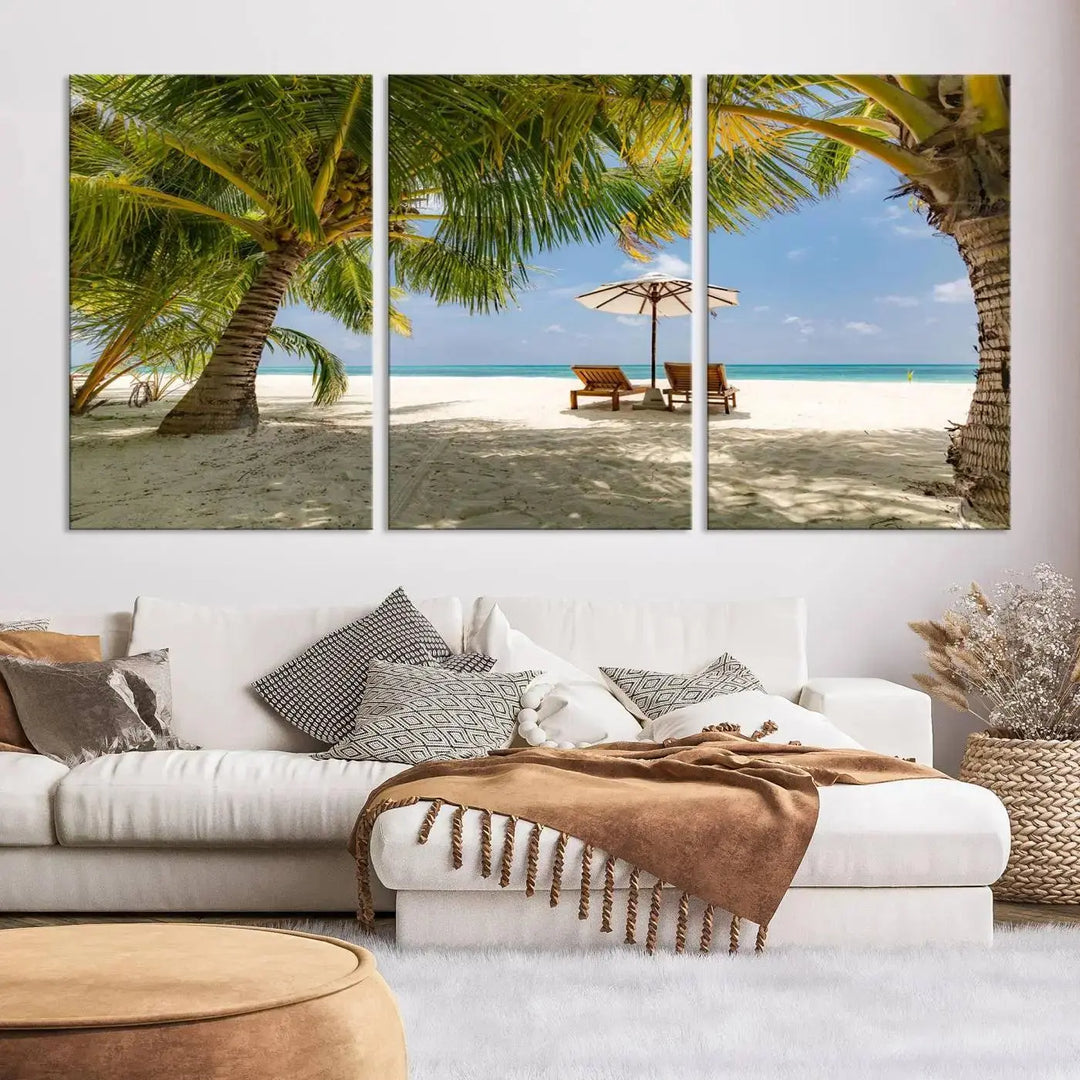 The living room features the "Lounge Chairs Palm Trees on Tropical Beach" canvas wall art print, offering museum-quality craftsmanship.