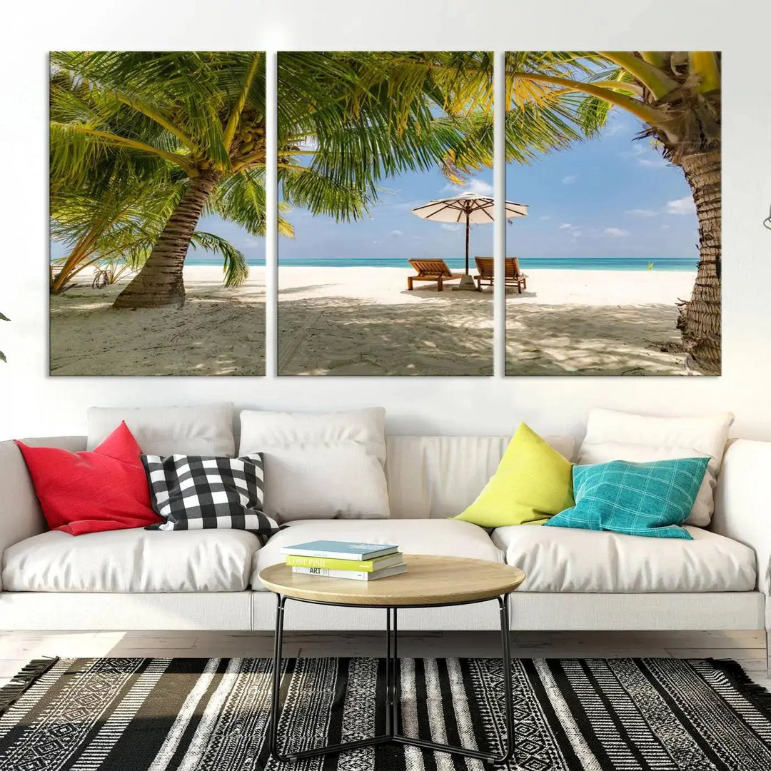 The living room features the "Lounge Chairs Palm Trees on Tropical Beach" canvas wall art print, offering museum-quality craftsmanship.