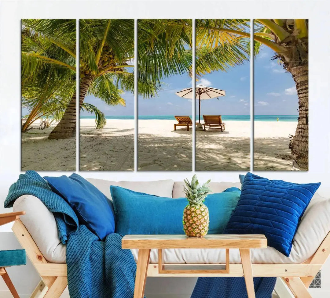 The living room features the "Lounge Chairs Palm Trees on Tropical Beach" canvas wall art print, offering museum-quality craftsmanship.