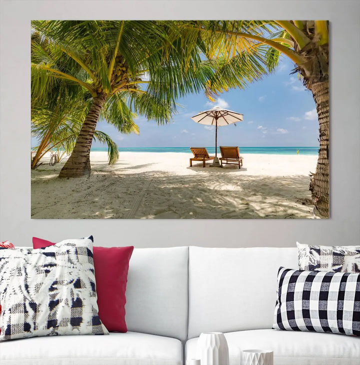 The living room features the "Lounge Chairs Palm Trees on Tropical Beach" canvas wall art print, offering museum-quality craftsmanship.