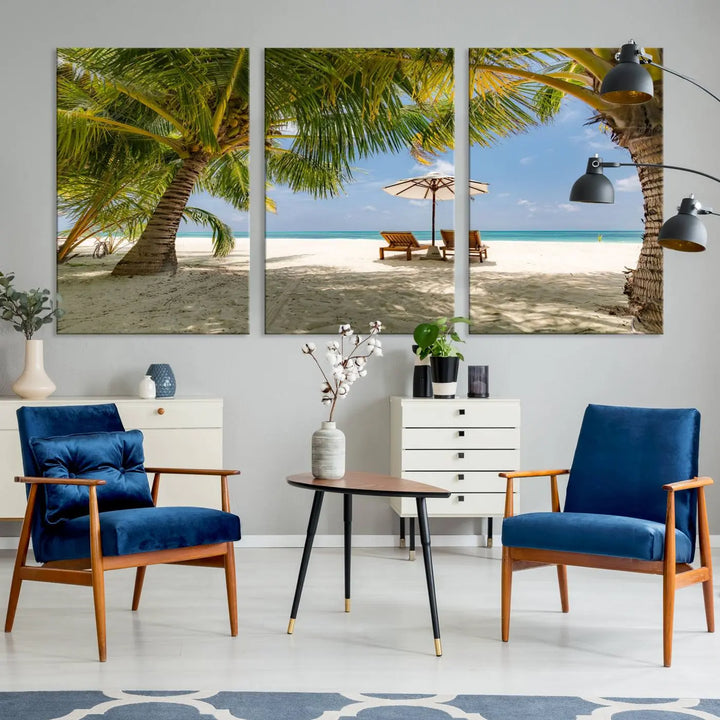 The living room features the "Lounge Chairs Palm Trees on Tropical Beach" canvas wall art print, offering museum-quality craftsmanship.