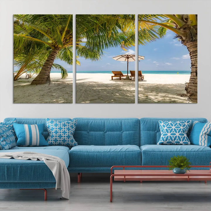 The living room features the "Lounge Chairs Palm Trees on Tropical Beach" canvas wall art print, offering museum-quality craftsmanship.