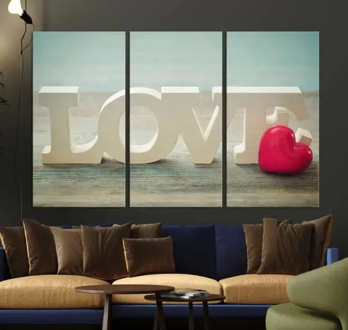 The Love Wall Art Canvas Print features the word "LOVE" in white block letters next to a vibrant red heart, enhanced with a UV-protective coating for durability. This piece adds enduring elegance and is crafted from museum-quality canvas, available with free shipping.