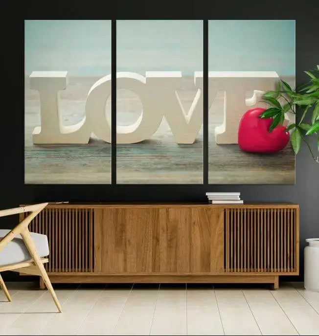 The Love Wall Art Canvas Print features the word "LOVE" in white block letters next to a vibrant red heart, enhanced with a UV-protective coating for durability. This piece adds enduring elegance and is crafted from museum-quality canvas, available with free shipping.