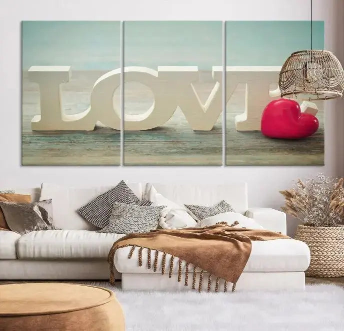 The Love Wall Art Canvas Print features the word "LOVE" in white block letters next to a vibrant red heart, enhanced with a UV-protective coating for durability. This piece adds enduring elegance and is crafted from museum-quality canvas, available with free shipping.