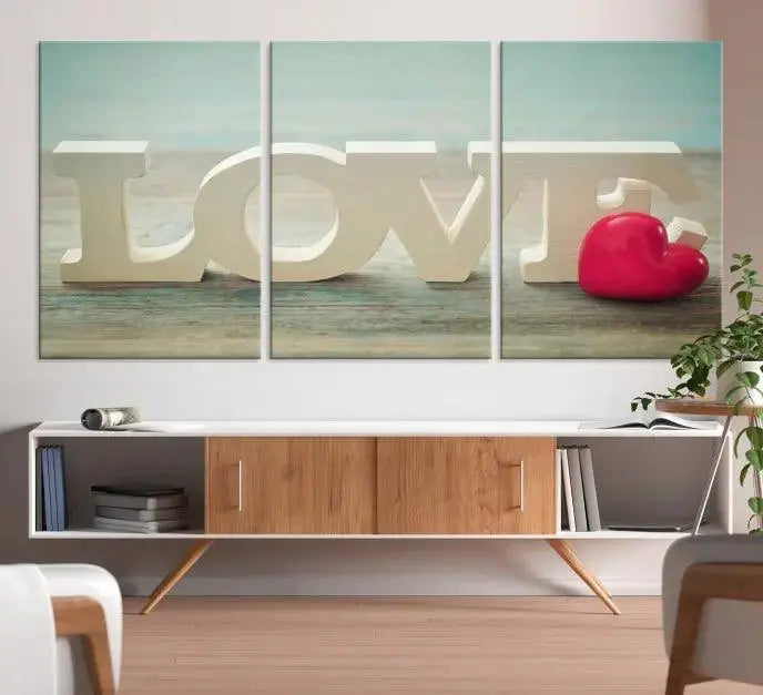 The Love Wall Art Canvas Print features the word "LOVE" in white block letters next to a vibrant red heart, enhanced with a UV-protective coating for durability. This piece adds enduring elegance and is crafted from museum-quality canvas, available with free shipping.