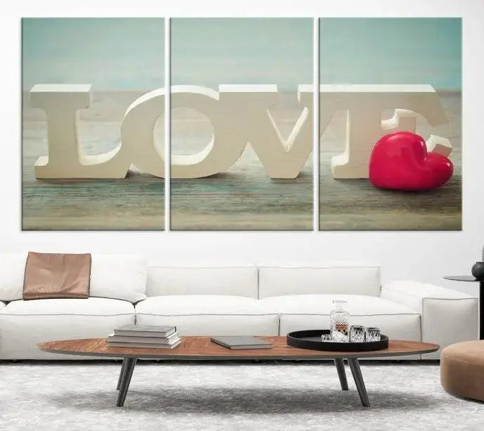 The Love Wall Art Canvas Print features the word "LOVE" in white block letters next to a vibrant red heart, enhanced with a UV-protective coating for durability. This piece adds enduring elegance and is crafted from museum-quality canvas, available with free shipping.