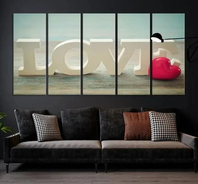 The Love Wall Art Canvas Print features the word "LOVE" in white block letters next to a vibrant red heart, enhanced with a UV-protective coating for durability. This piece adds enduring elegance and is crafted from museum-quality canvas, available with free shipping.