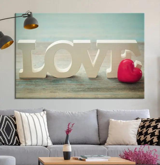 The Love Wall Art Canvas Print features the word "LOVE" in white block letters next to a vibrant red heart, enhanced with a UV-protective coating for durability. This piece adds enduring elegance and is crafted from museum-quality canvas, available with free shipping.