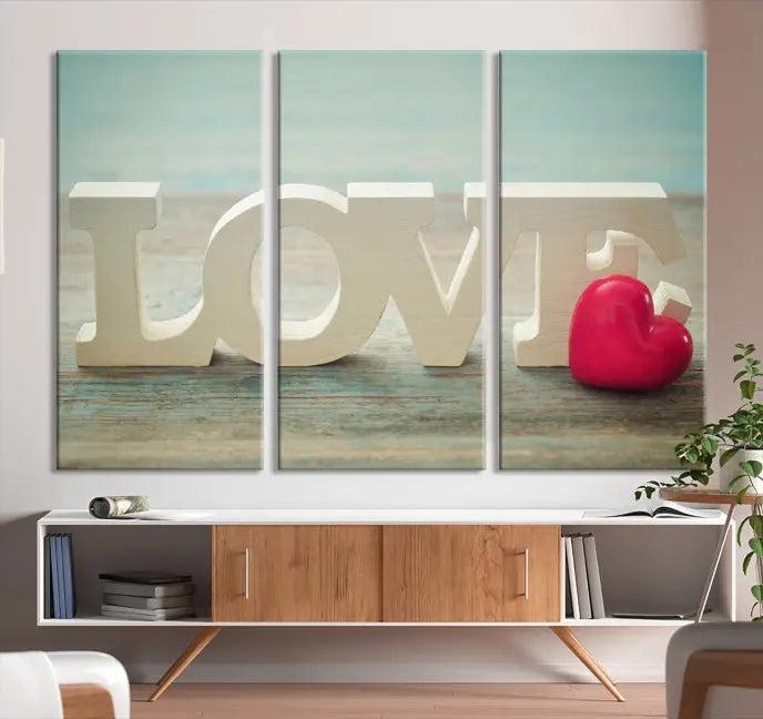 The Love Wall Art Canvas Print features the word "LOVE" in white block letters next to a vibrant red heart, enhanced with a UV-protective coating for durability. This piece adds enduring elegance and is crafted from museum-quality canvas, available with free shipping.