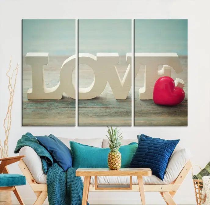 The Love Wall Art Canvas Print features the word "LOVE" in white block letters next to a vibrant red heart, enhanced with a UV-protective coating for durability. This piece adds enduring elegance and is crafted from museum-quality canvas, available with free shipping.