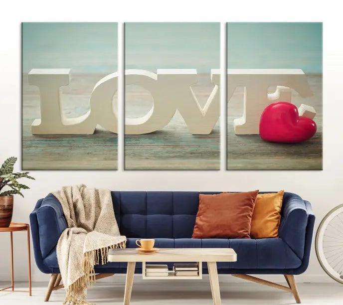 The Love Wall Art Canvas Print features the word "LOVE" in white block letters next to a vibrant red heart, enhanced with a UV-protective coating for durability. This piece adds enduring elegance and is crafted from museum-quality canvas, available with free shipping.