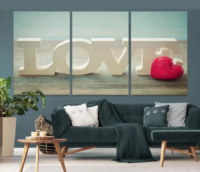 The Love Wall Art Canvas Print features the word "LOVE" in white block letters next to a vibrant red heart, enhanced with a UV-protective coating for durability. This piece adds enduring elegance and is crafted from museum-quality canvas, available with free shipping.