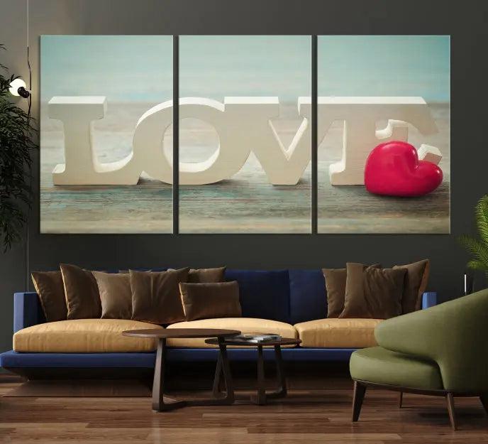 The Love Wall Art Canvas Print features the word "LOVE" in white block letters next to a vibrant red heart, enhanced with a UV-protective coating for durability. This piece adds enduring elegance and is crafted from museum-quality canvas, available with free shipping.