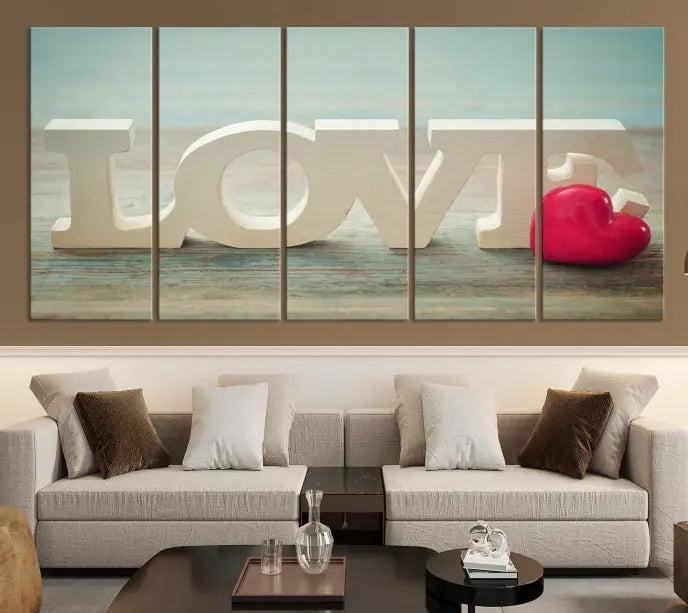 The Love Wall Art Canvas Print features the word "LOVE" in white block letters next to a vibrant red heart, enhanced with a UV-protective coating for durability. This piece adds enduring elegance and is crafted from museum-quality canvas, available with free shipping.