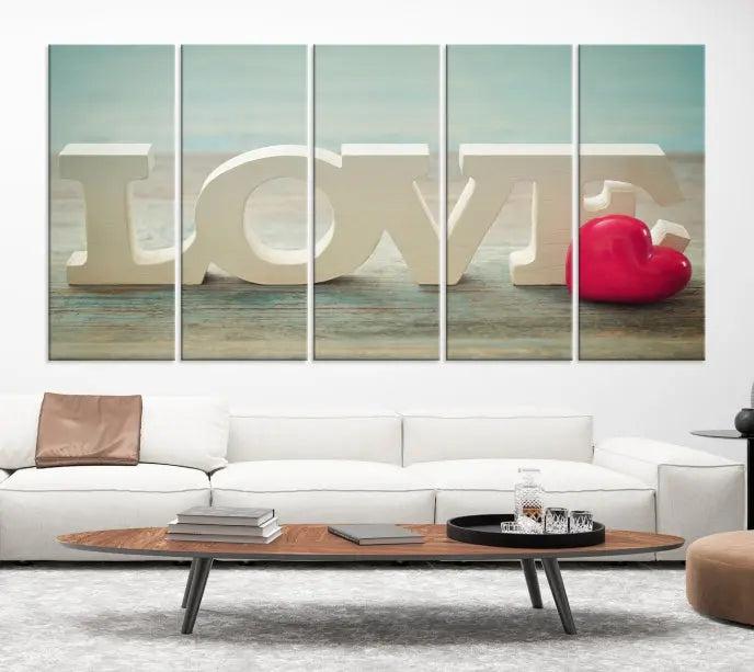 The Love Wall Art Canvas Print features the word "LOVE" in white block letters next to a vibrant red heart, enhanced with a UV-protective coating for durability. This piece adds enduring elegance and is crafted from museum-quality canvas, available with free shipping.