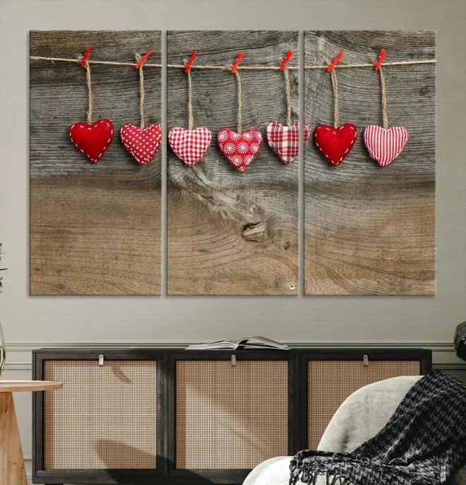 The "Love on the Wood Wall Art Canvas Print" enhances the modern living room with its hanging heart designs. The museum-quality canvases feature a UV-protective coating, ensuring their beauty lasts over time.