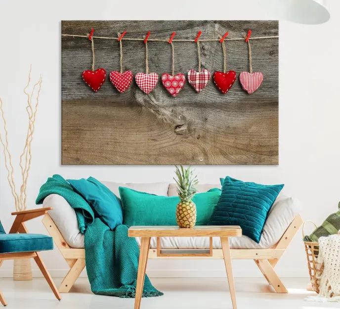 The "Love on the Wood Wall Art Canvas Print" enhances the modern living room with its hanging heart designs. The museum-quality canvases feature a UV-protective coating, ensuring their beauty lasts over time.