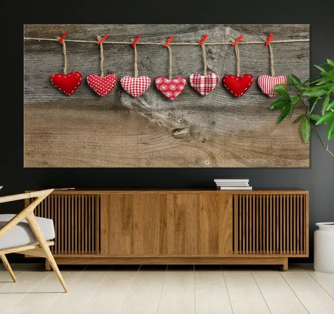 The "Love on the Wood Wall Art Canvas Print" enhances the modern living room with its hanging heart designs. The museum-quality canvases feature a UV-protective coating, ensuring their beauty lasts over time.