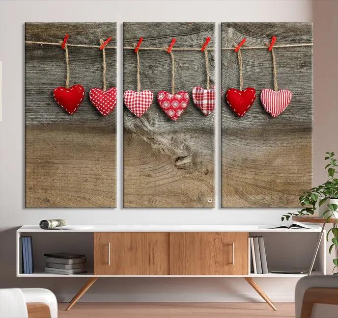 The "Love on the Wood Wall Art Canvas Print" enhances the modern living room with its hanging heart designs. The museum-quality canvases feature a UV-protective coating, ensuring their beauty lasts over time.