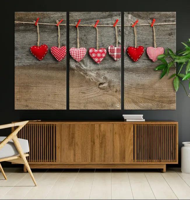 The "Love on the Wood Wall Art Canvas Print" enhances the modern living room with its hanging heart designs. The museum-quality canvases feature a UV-protective coating, ensuring their beauty lasts over time.