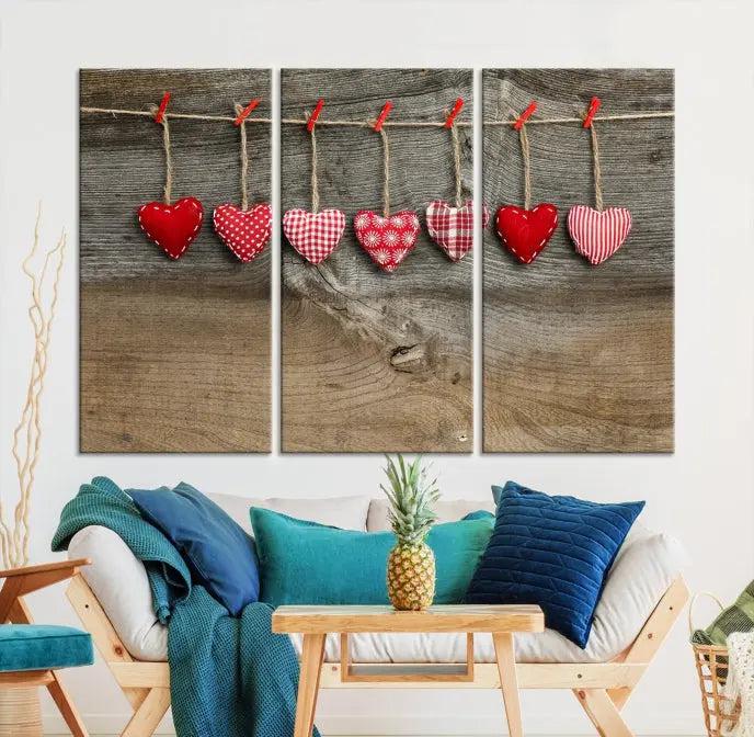 The "Love on the Wood Wall Art Canvas Print" enhances the modern living room with its hanging heart designs. The museum-quality canvases feature a UV-protective coating, ensuring their beauty lasts over time.