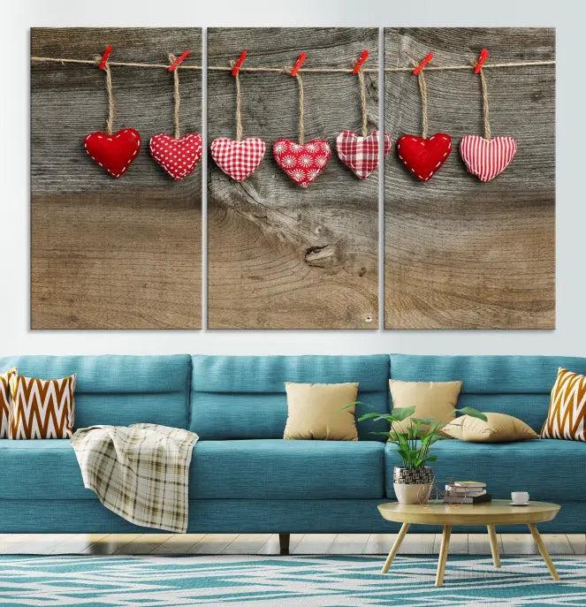 The "Love on the Wood Wall Art Canvas Print" enhances the modern living room with its hanging heart designs. The museum-quality canvases feature a UV-protective coating, ensuring their beauty lasts over time.