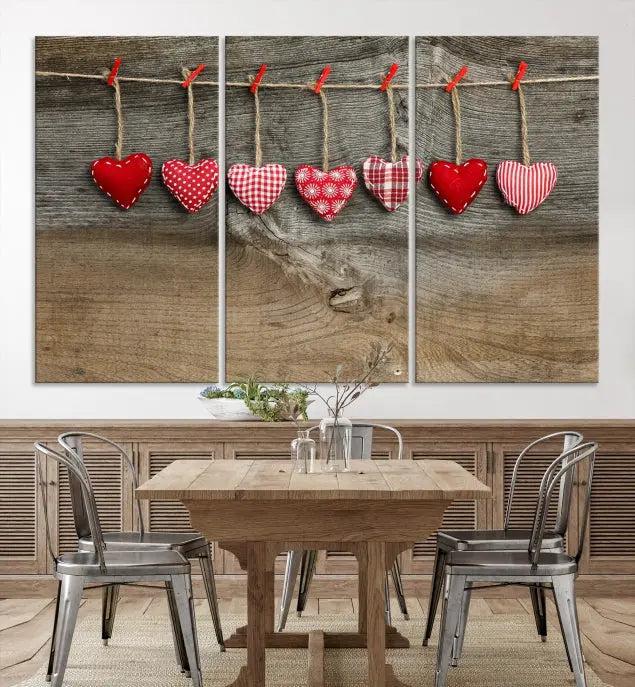 The "Love on the Wood Wall Art Canvas Print" enhances the modern living room with its hanging heart designs. The museum-quality canvases feature a UV-protective coating, ensuring their beauty lasts over time.